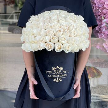 Black velvet box with 50 white roses